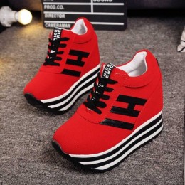Trendy Red Platform Sneakers with Bold Stripes and Wedge Heel