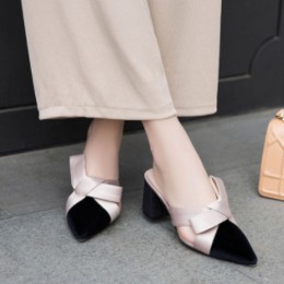 Elegance Reimagined Black Slingback Heels with Bold Cream Bow