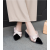 Elegance Reimagined Black Slingback Heels with Bold Cream Bow