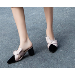 Elegance Reimagined Black Slingback Heels with Bold Cream Bow