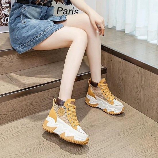 Stylish women's yellow and white high top platform sneakers with chunky sole and lace-up design