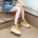 Stylish women's yellow and white high top platform sneakers with chunky sole and lace-up design
