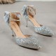 Elegant black glitter stiletto heel with pointed toe, ankle strap, and decorative bow for women
