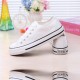Classic White Canvas Sneakers with Timeless White Accents image