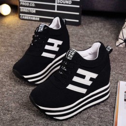 Trendy Black Platform Sneakers with Bold Stripes and Wedge Heel